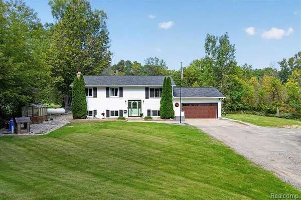 2 Acres of Land with Home for Sale in Oceola Township, Michigan