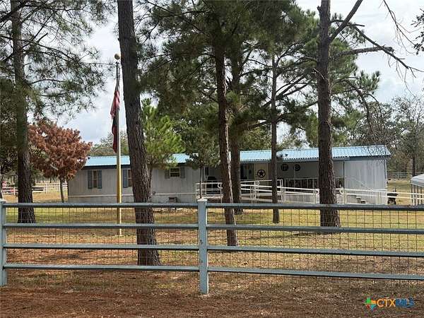 12.2 Acres of Land with Home for Sale in Stockdale, Texas