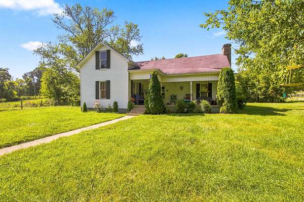 6.9 Acres of Land with Home for Sale in College Grove, Tennessee