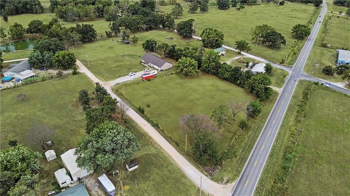 2.62 Acres of Land with Home for Sale in Gravette, Arkansas