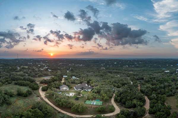 31.8 Acres of Agricultural Land with Home for Sale in Dripping Springs, Texas