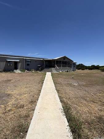 61.2 Acres of Agricultural Land with Home for Sale in Rocksprings, Texas