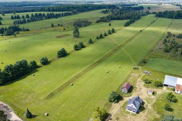 209 Acres of Recreational Land with Home for Sale in Bark River, Michigan