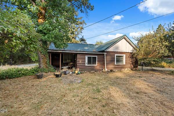 6.72 Acres of Land with Home for Sale in Cave Junction, Oregon