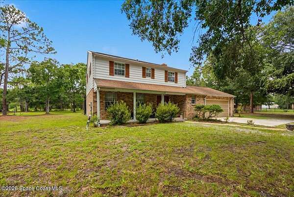 2.34 Acres of Land with Home for Sale in Palm Bay, Florida