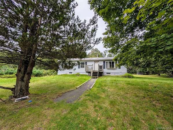 7.14 Acres of Land with Home for Sale in Swan Lake, New York
