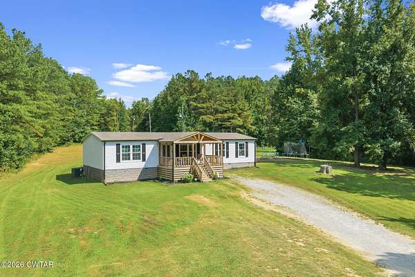 5.5 Acres of Land with Home for Sale in Lexington, Tennessee