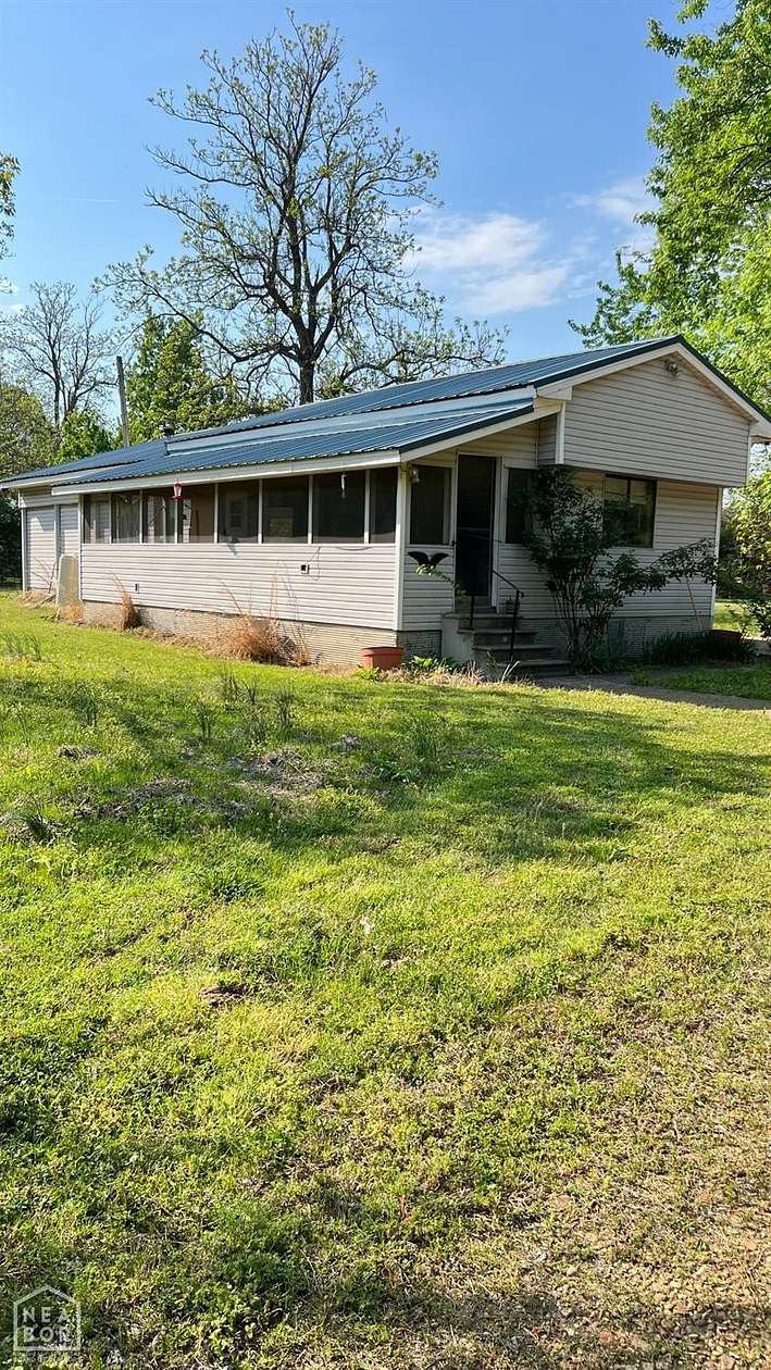 14.2 Acres of Land with Home for Sale in Paragould, Arkansas