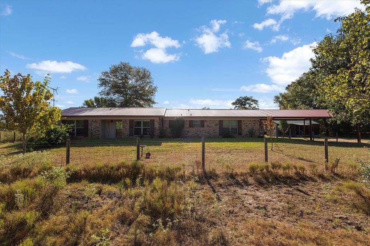 9.85 Acres of Land with Home for Sale in Gilmer, Texas