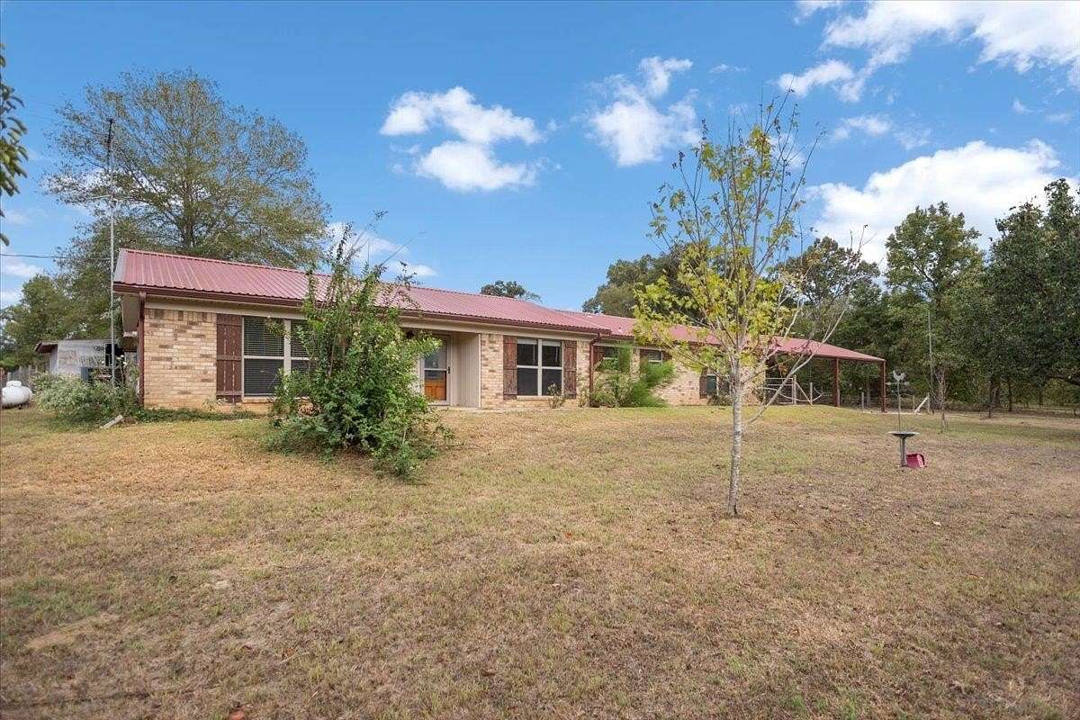 9.85 Acres of Land with Home for Sale in Gilmer, Texas