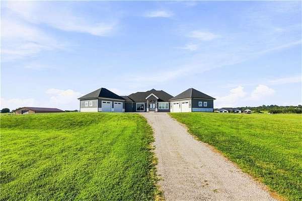 10.5 Acres of Land with Home for Sale in Raymore, Missouri