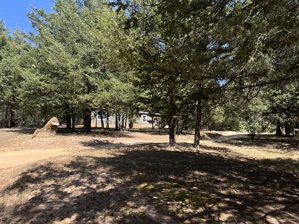 15 Acres of Land with Home for Sale in Ravenna, Texas