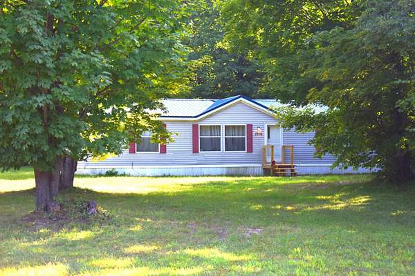5 Acres of Land with Home for Sale in Mancelona, Michigan