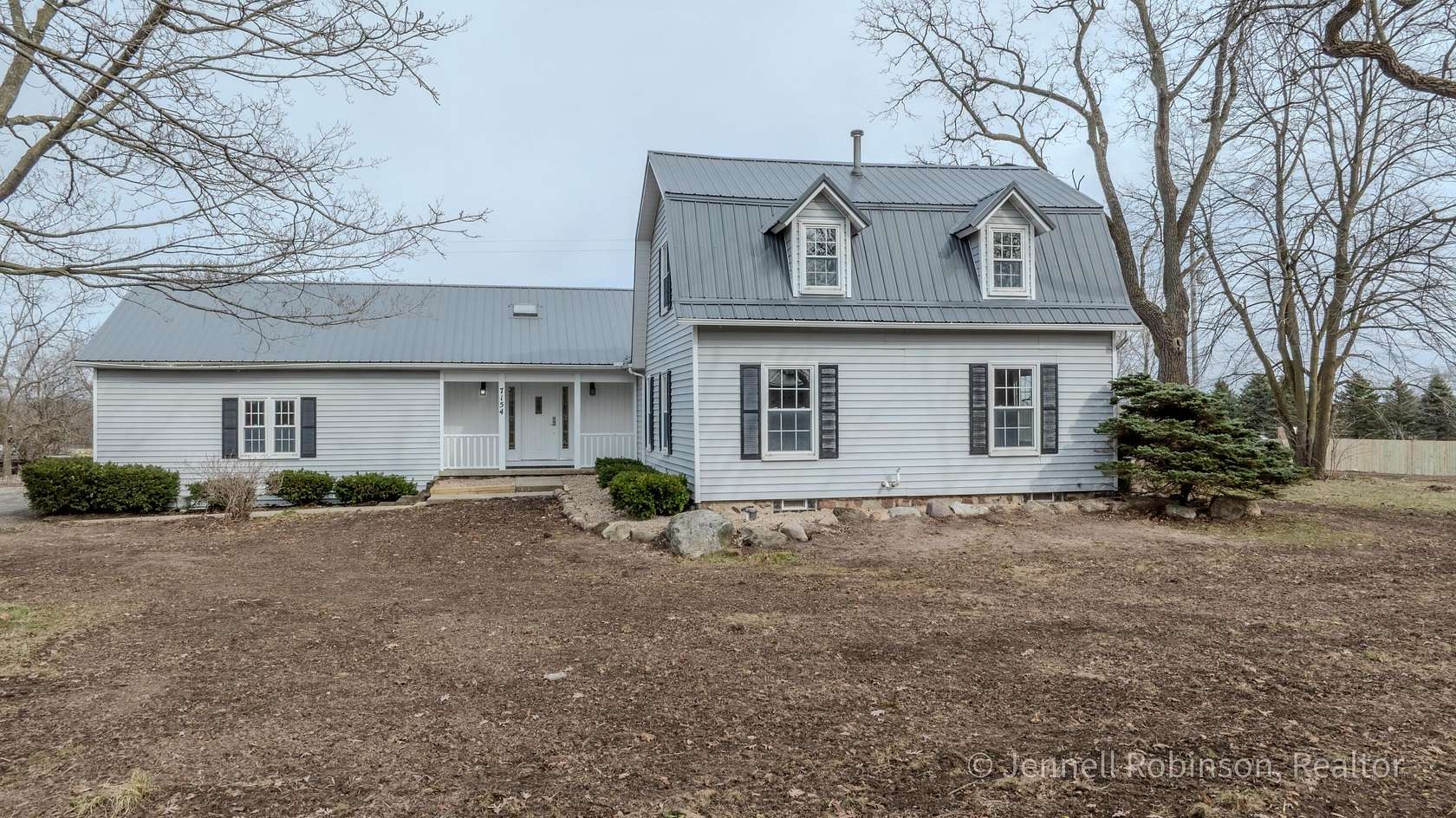 2.5 Acres of Land with Home for Sale in Alto, Michigan