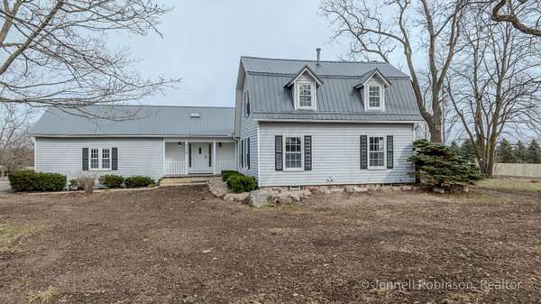 2.5 Acres of Land with Home for Sale in Alto, Michigan