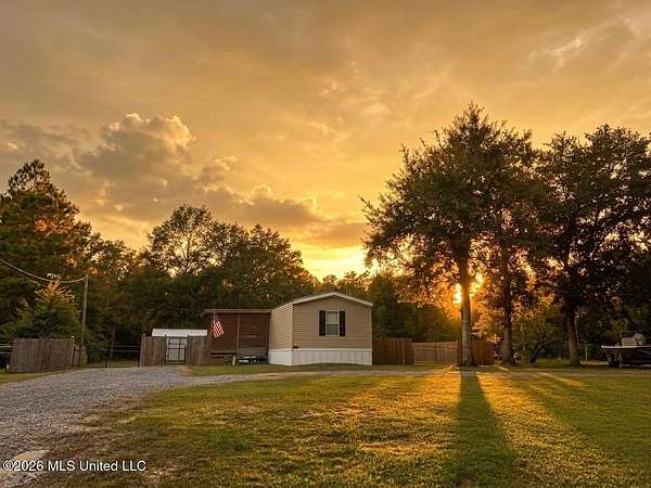1.84 Acres of Land with Home for Sale in Kiln, Mississippi