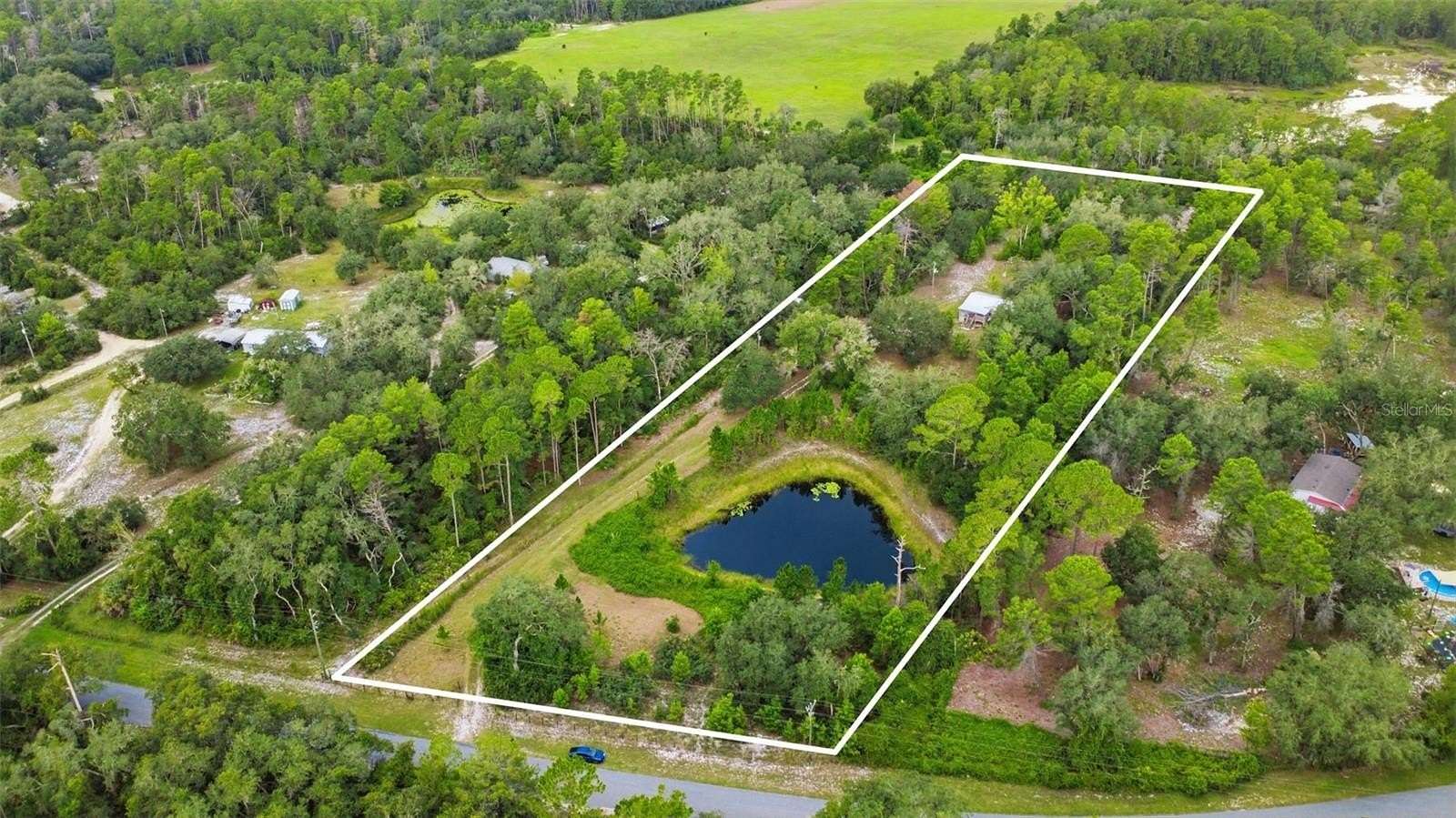 4.82 Acres of Land with Home for Sale in Eustis, Florida