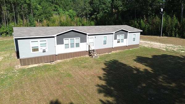24.7 Acres of Recreational Land with Home for Sale in Kirbyville, Texas