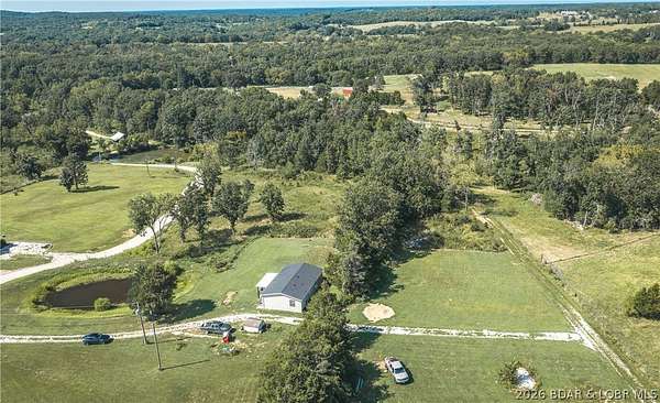 11.4 Acres of Land with Home for Sale in Brumley, Missouri