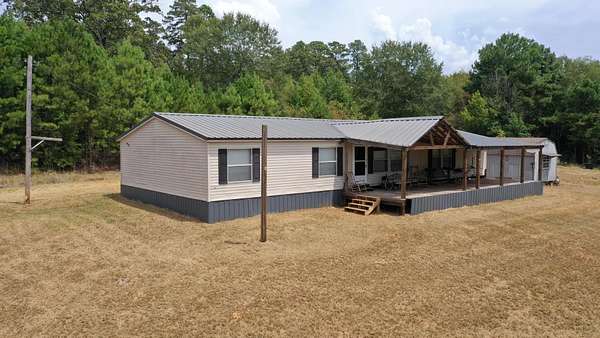 35.8 Acres of Recreational Land with Home for Sale in Jefferson, Texas
