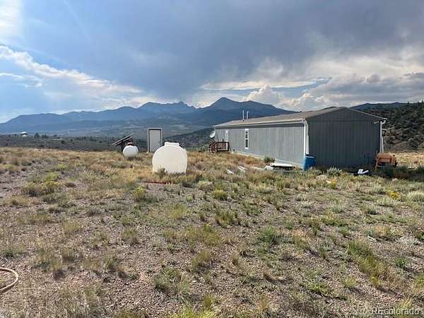 6.54 Acres of Land with Home for Sale in Fort Garland, Colorado