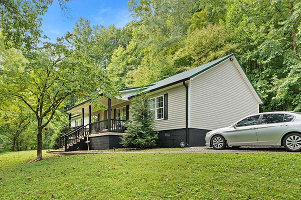 5.64 Acres of Land with Home for Sale in Santa Fe, Tennessee