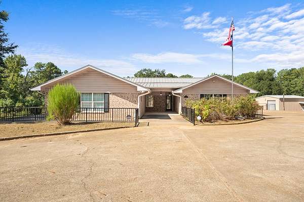 10.7 Acres of Recreational Land with Home for Sale in Palestine, Texas