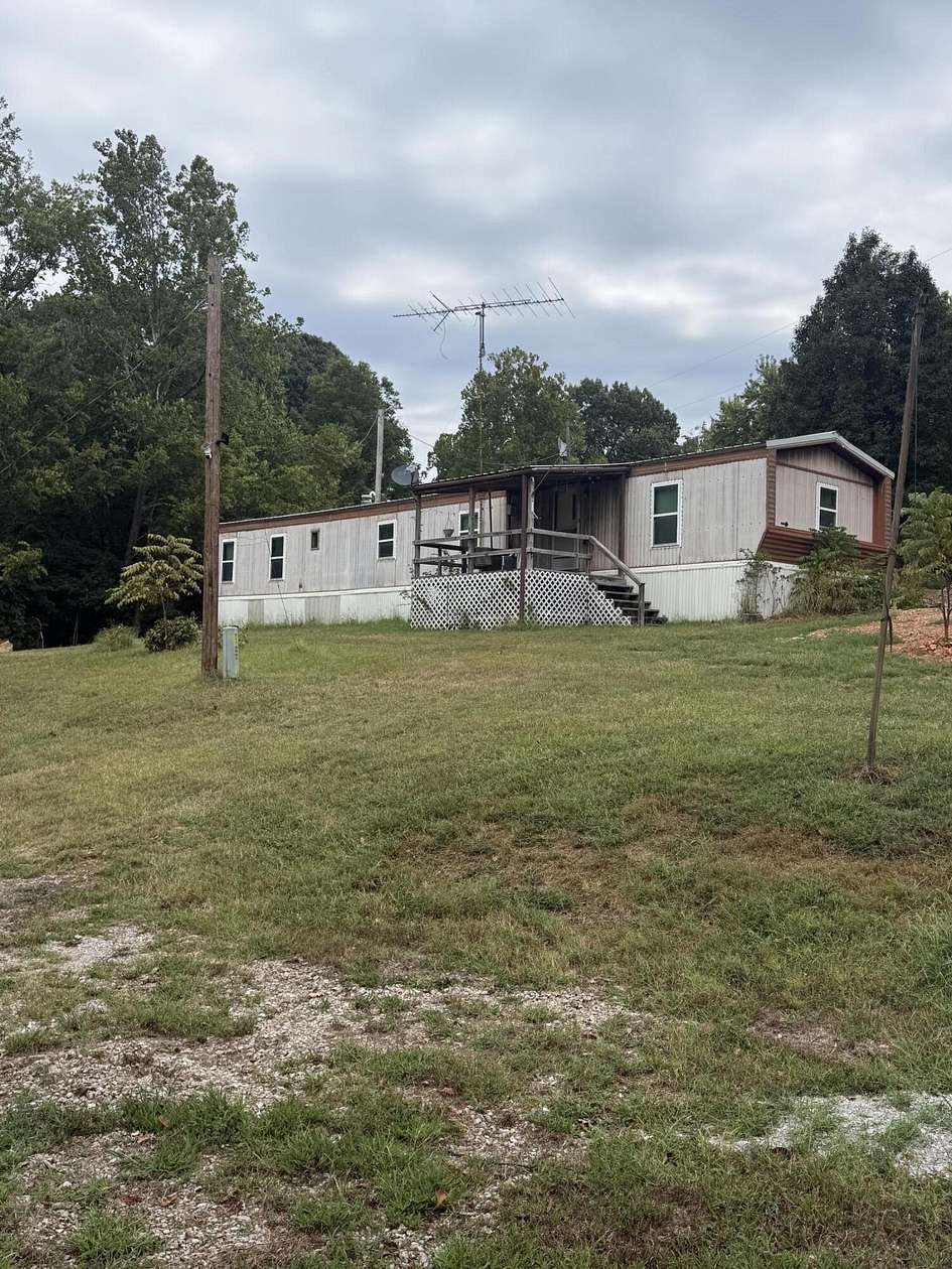 15 Acres of Recreational Land with Home for Sale in Goodman, Missouri