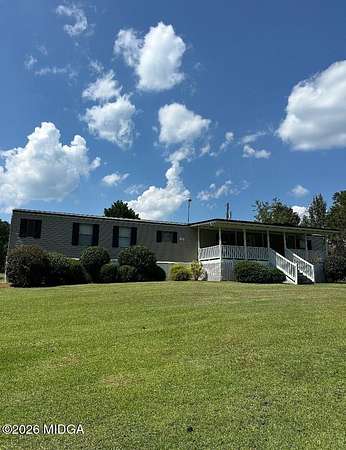 6.78 Acres of Land with Home for Sale in Haddock, Georgia