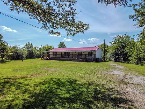 1.67 Acres of Land with Home for Sale in Madisonville, Tennessee