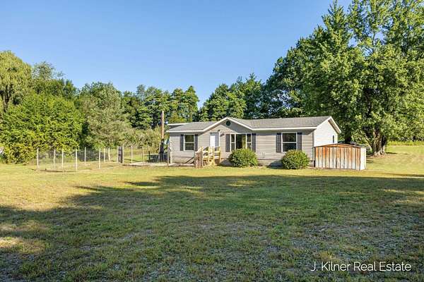 2 Acres of Land with Home for Sale in Cedar Springs, Michigan