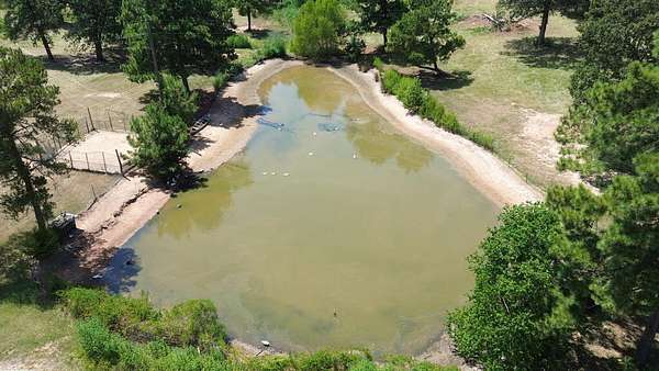 21.5 Acres of Agricultural Land with Home for Sale in Crockett, Texas