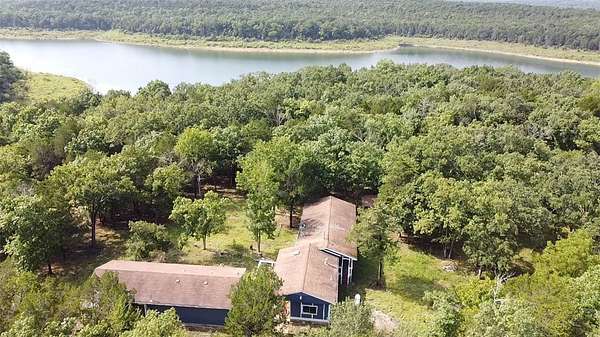 6.88 Acres of Land with Home for Sale in Peel, Arkansas