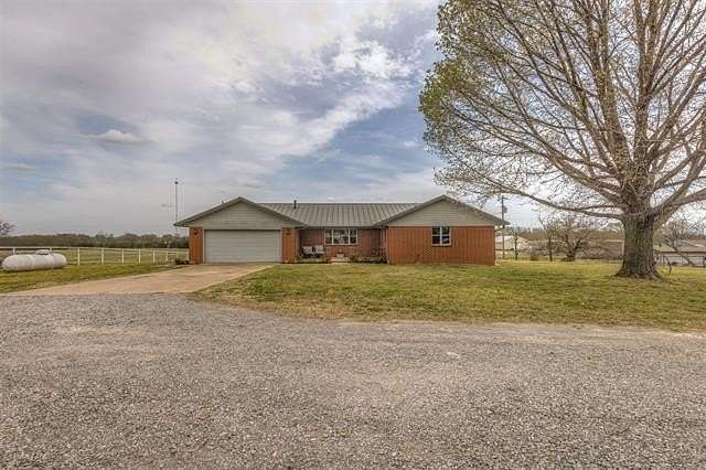 10 Acres of Land with Home for Sale in Chouteau, Oklahoma