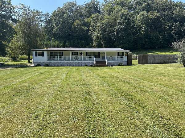 1.5 Acres of Land with Home for Sale in Clay City, Kentucky