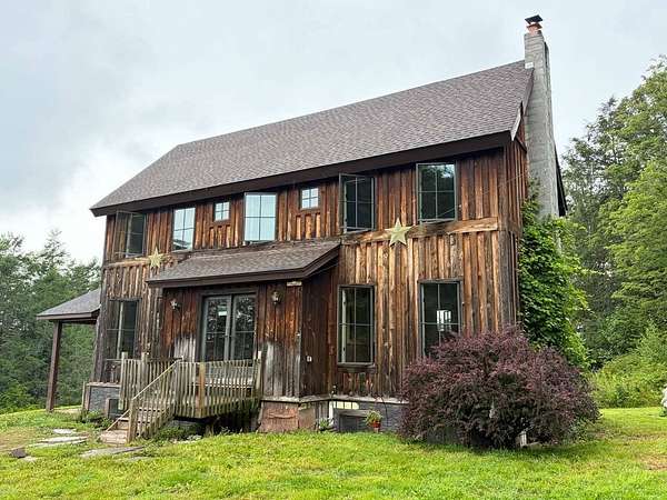 5.5 Acres of Land with Home for Auction in Swan Lake, New York