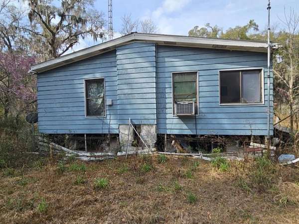 4.25 Acres of Land with Home for Sale in Citra, Florida