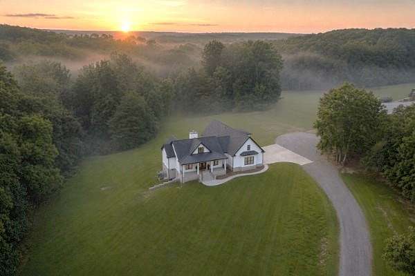 5 Acres of Land with Home for Sale in Bon Aqua, Tennessee