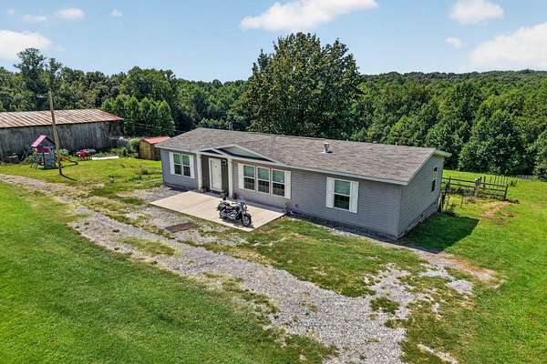 16.6 Acres of Land with Home for Auction in Smithville, Tennessee
