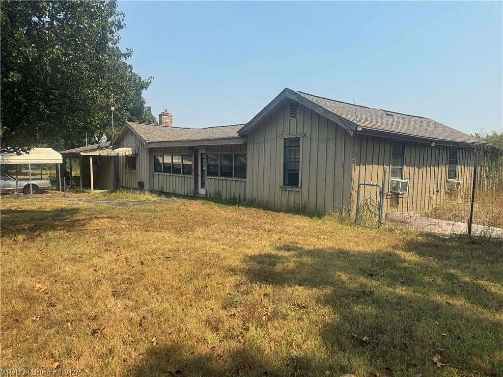 7.44 Acres of Land with Home for Sale in Booneville, Arkansas