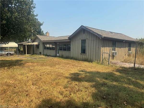 7.44 Acres of Land with Home for Sale in Booneville, Arkansas