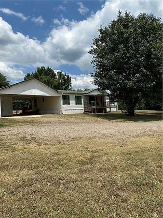 7.78 Acres of Land with Home for Sale in Atkins, Arkansas