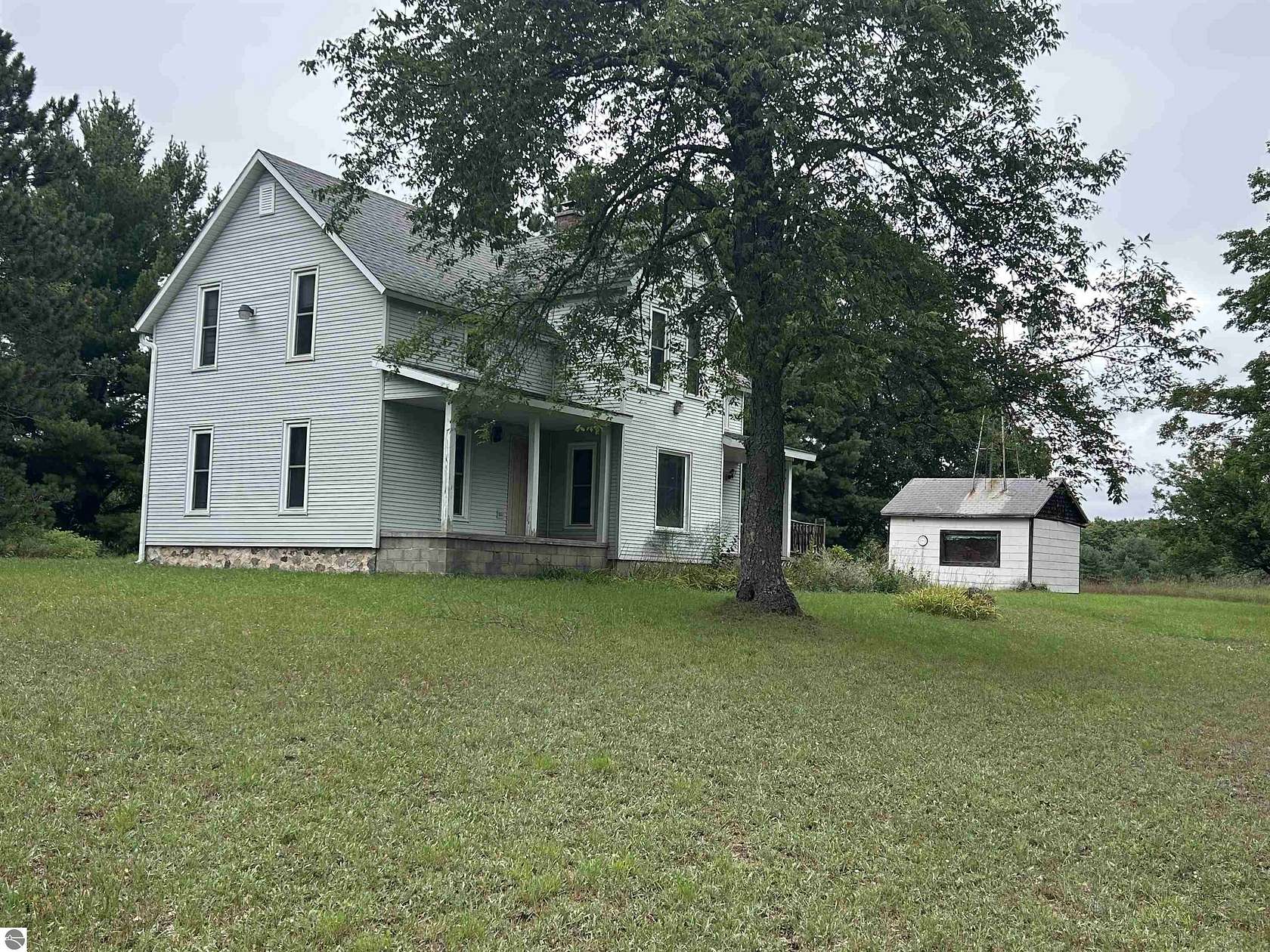 54 Acres of Recreational Land with Home for Sale in Mancelona, Michigan