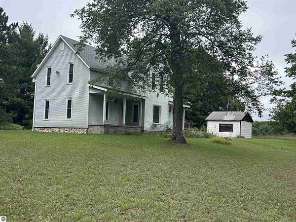 54 Acres of Recreational Land with Home for Sale in Mancelona, Michigan