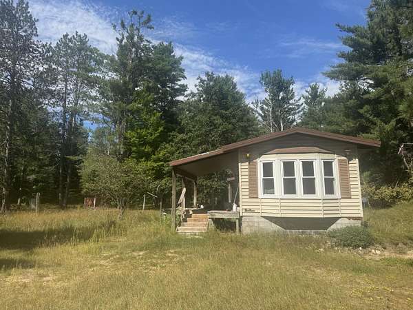 10 Acres of Land with Home for Sale in Vanderbilt, Michigan