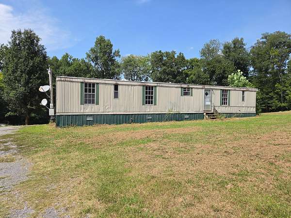 1.73 Acres of Land with Home for Auction in Smithville, Tennessee