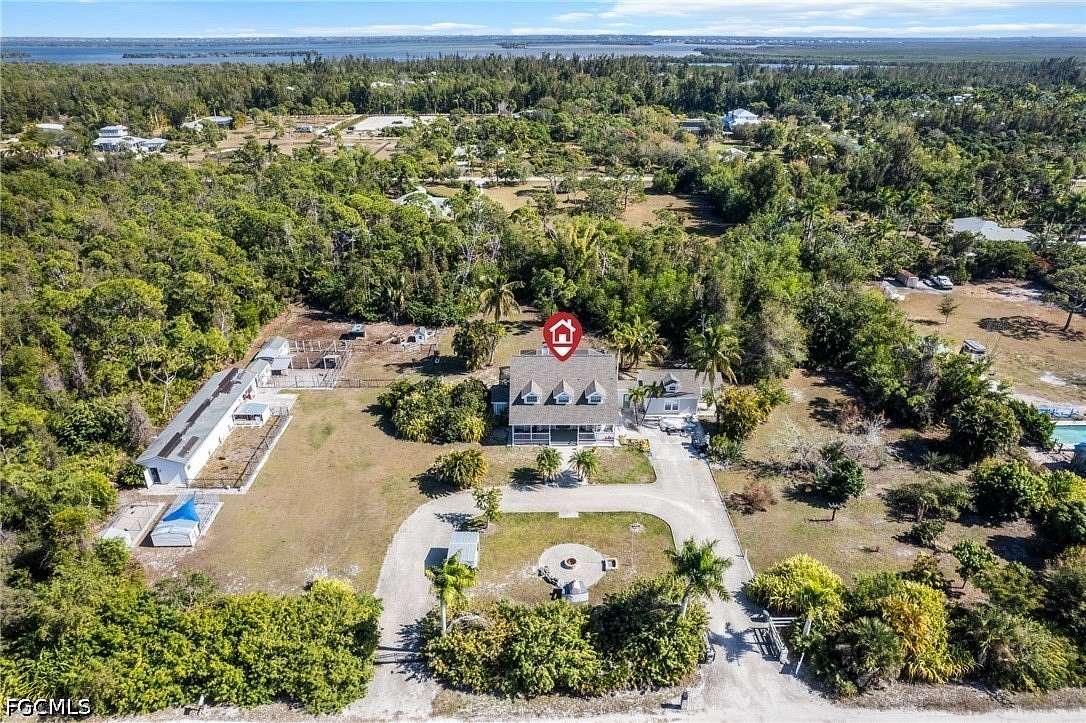 2.65 Acres of Land with Home for Sale in Bokeelia, Florida