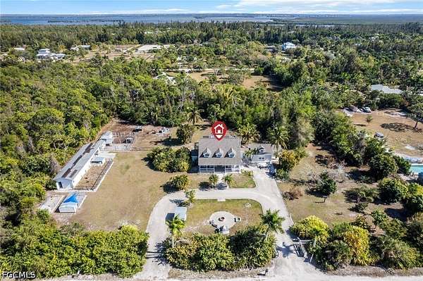 2.65 Acres of Land with Home for Sale in Bokeelia, Florida