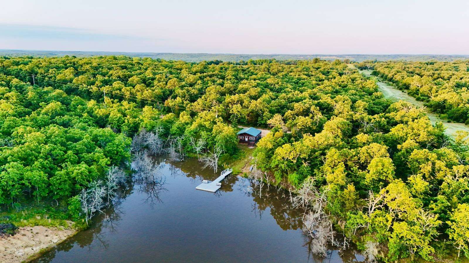 81.4 Acres of Recreational Land with Home for Sale in Stuart, Oklahoma