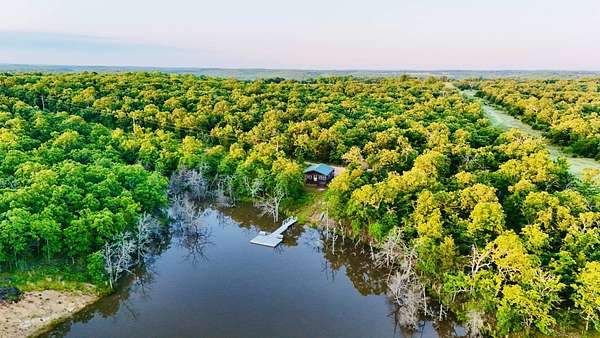 81.4 Acres of Recreational Land with Home for Sale in Stuart, Oklahoma